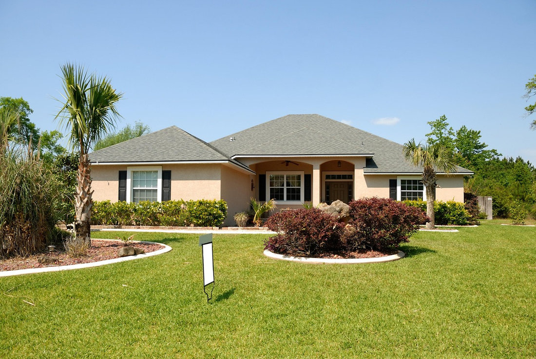 Single-story home with a gray shingle roof