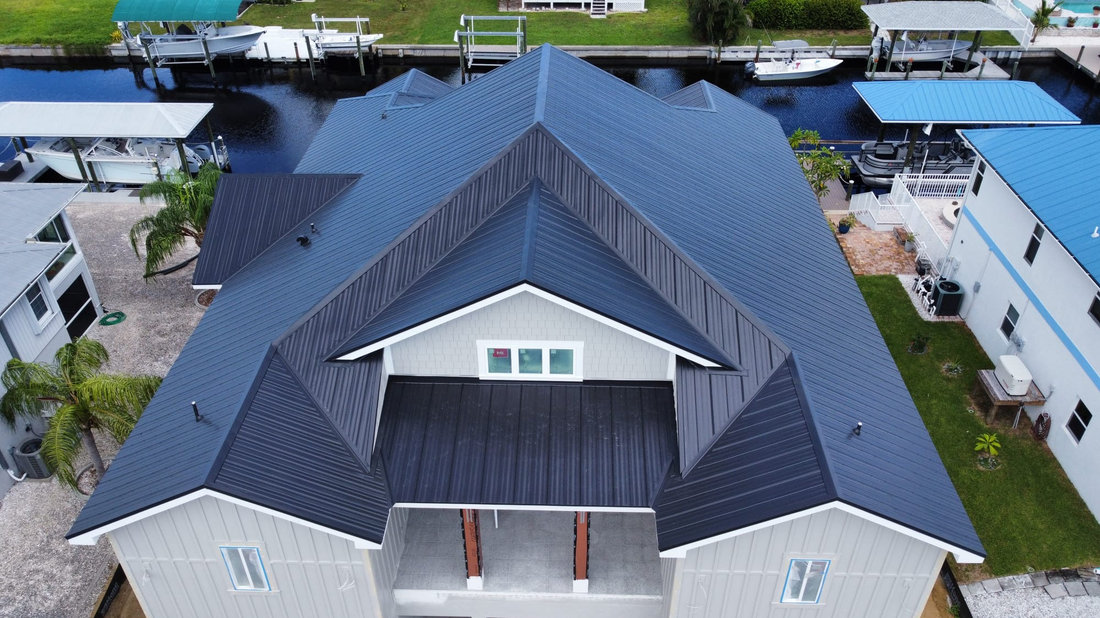 Silver metal roof on a waterfront home